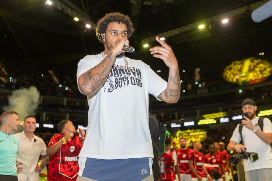 AJ Tracey performing at the Baller League final.