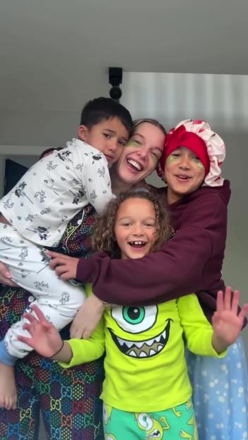 Helen Flanagan with green patches under her eyes, laughing and hugging her three smiling children.