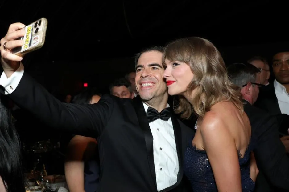 Eli Roth and Taylor Swift take a selfie at the Academy Museum Gala.