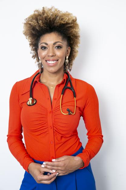 Dr. Zoe, a woman with curly hair, wearing an orange top, blue skirt, and a stethoscope.
