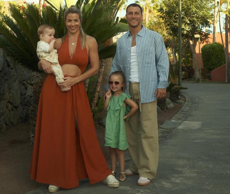 Gemma Atkinson, Gorka, and their two children posing for a family photo.