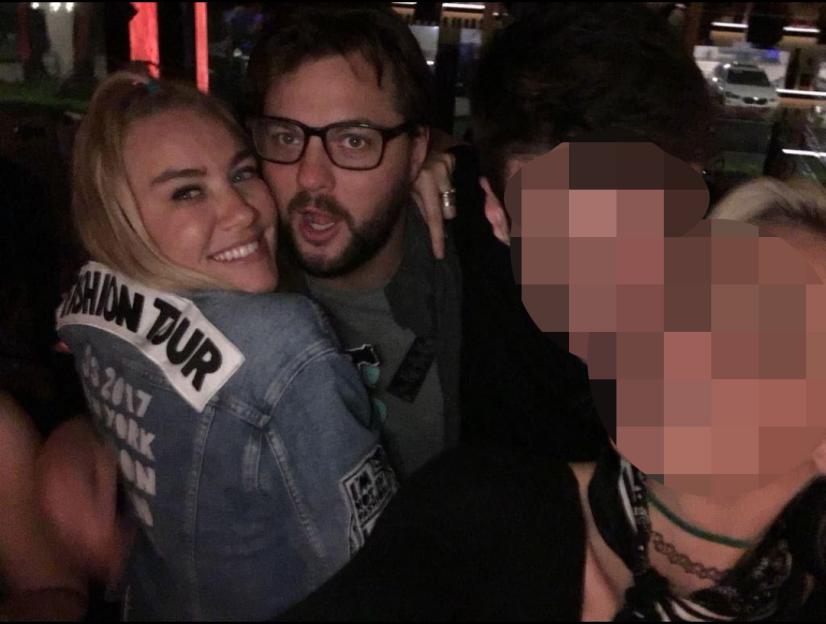Matthew Pringle and Liv Nevro smiling, with another person blurred out.