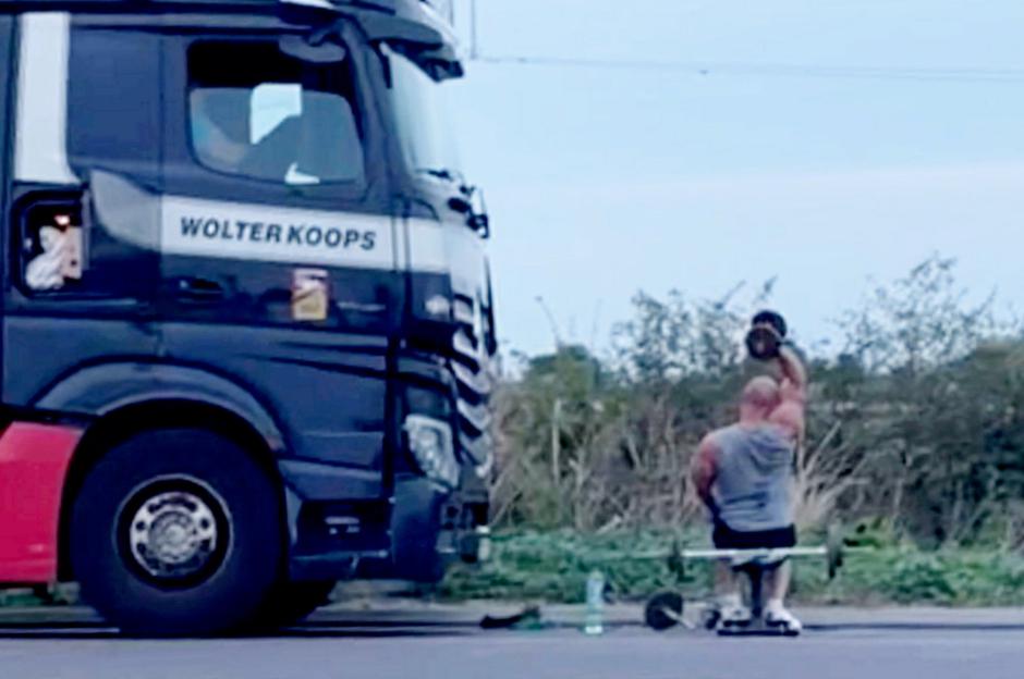 Bemused motorist spots lorry driver weight-lifting on A-road hard shoulder