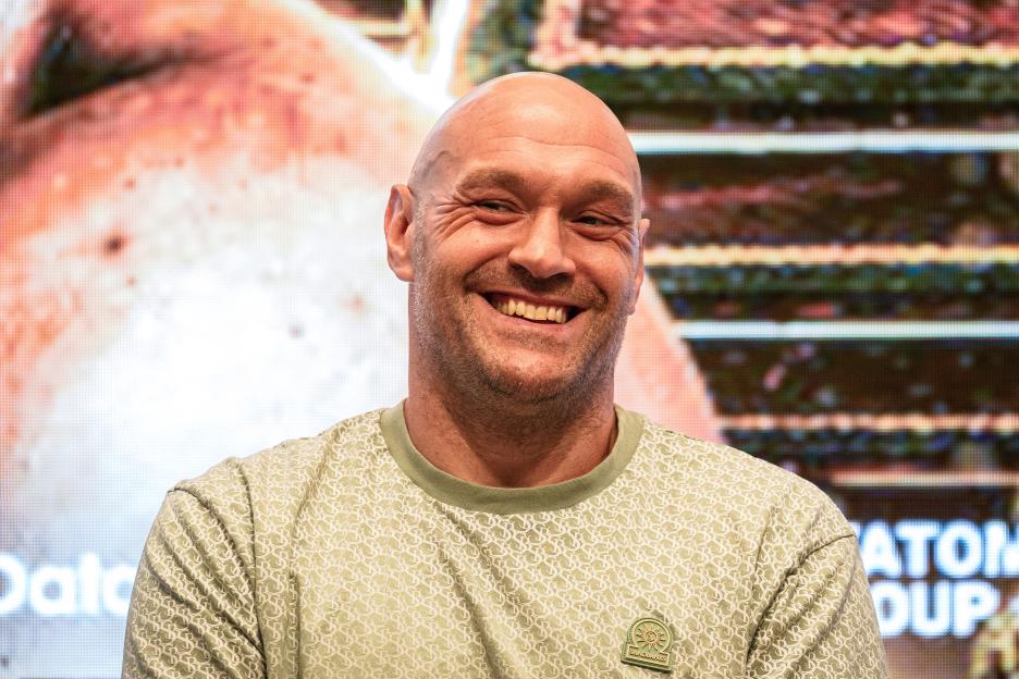 Tyson Fury reacts during a press conference.