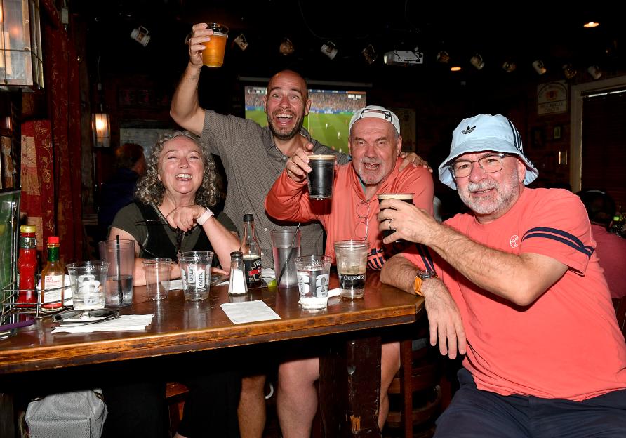 Dane and Rebecca Dias enjoy a pint outside of a local Brit bar in Dallas, Texas.
