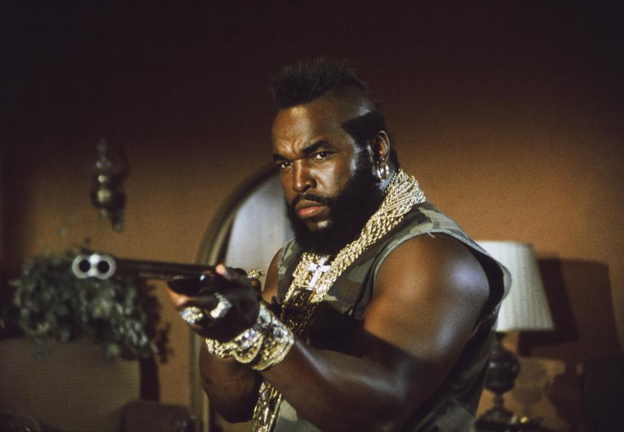 B.A. Baracus from The A-Team holding a shotgun.