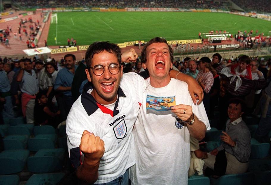 Comedians David Baddiel and Frank Skinner celebrating at a World Cup Qualifier game in Italy.