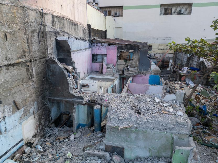 View of a demolished row of rooms where Abigail Ocampo Jurado lives, with Mount Arayat in the distance, Angeles City, Philippines.