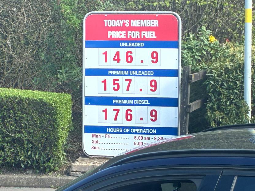 Costco fuel price sign displaying member prices for unleaded at 146.9, premium unleaded at 157.9, and premium diesel at 176.9.