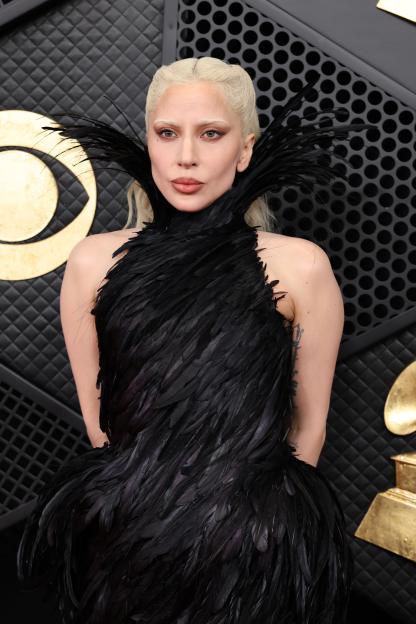 Lady Gaga in a black feathered dress at the GRAMMY Awards.