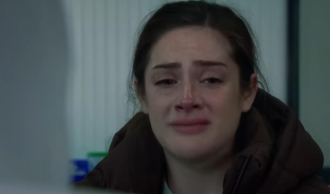 A close-up of a woman crying.