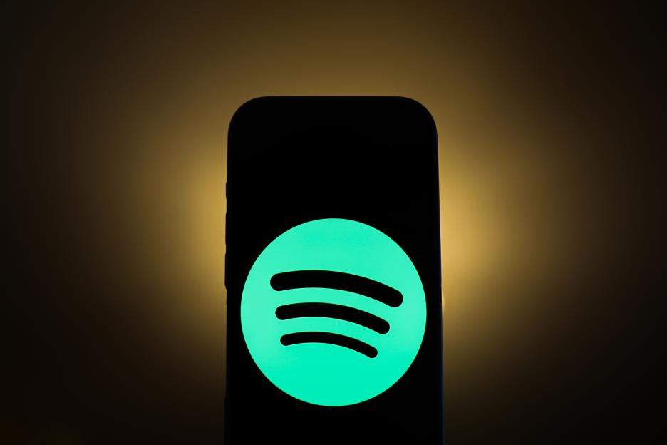 A smartphone displaying the Spotify logo.