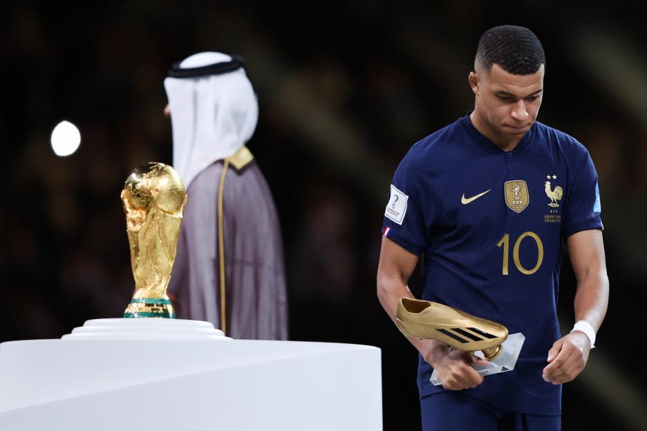 Kylian Mbappe with the golden boot trophy and a close-up of the FIFA World Cup trophy.