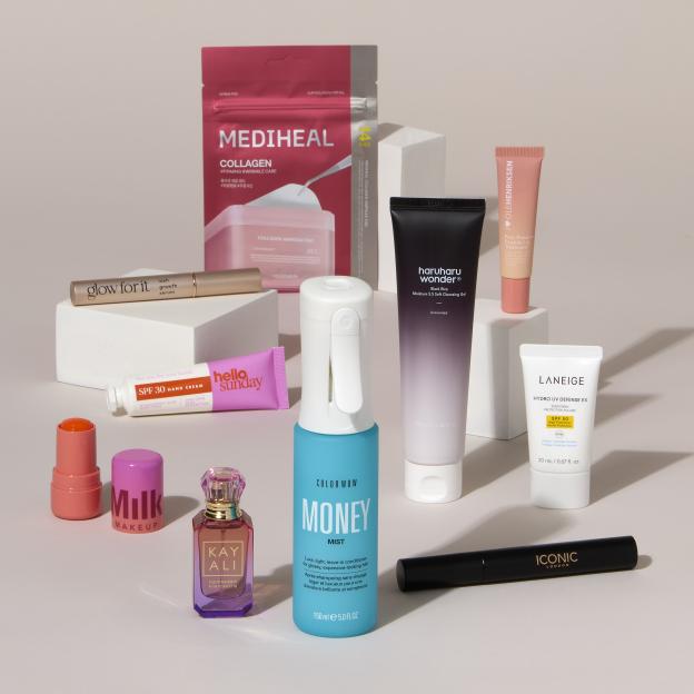 A Boots Beauty Box Trending Box with a collection of cosmetic and skincare products, including a Medeheal Collagen Ampoule Pad, a Glow For It lash growth serum, Hello Sunday SPF 30 Hand Cream, Milk Makeup blush, Kay Ali perfume, Color Wow hair mist, Haruharu Wonder cleansing gel, Olehenriksen lip treatment, Laneige SPF 50 sunscreen, and Iconic London mascara.