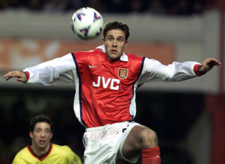 Footballer Darren Anderton heading a soccer ball.