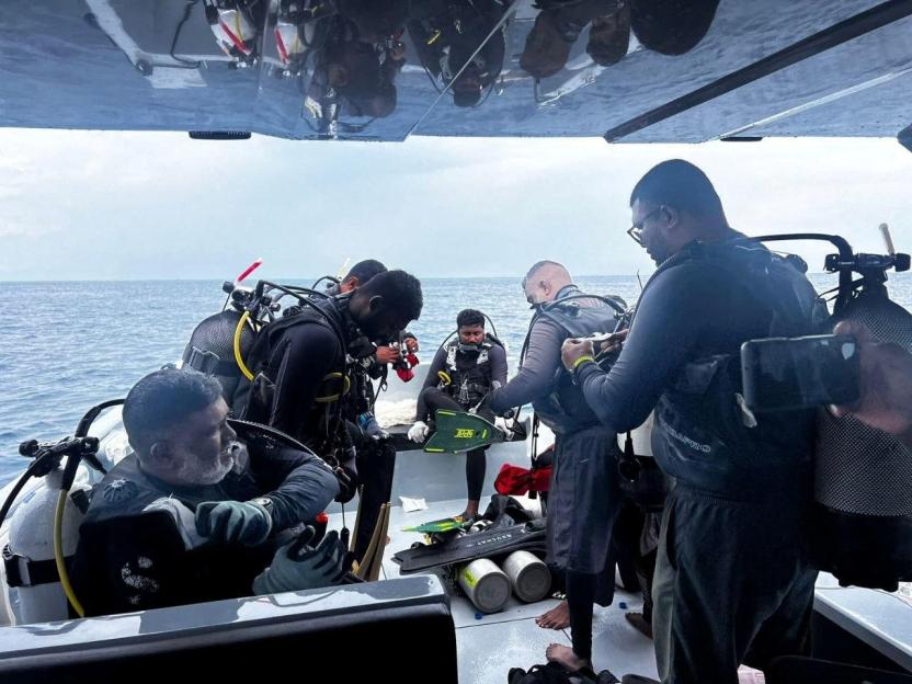 Members of MNDF prepare to take part in a search and recovery operation for four Italian scuba divers in the waters of Vaavu Atoll