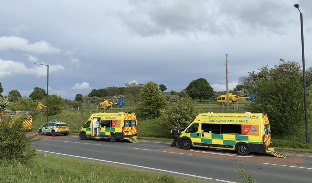 Emergency services, including police, ambulances, and helicopters, at the scene of a crash on the A59 in Gisburn.