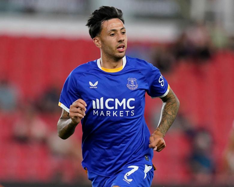 Dwight McNeil of Everton in a blue jersey with "CMC Markets" sponsorship.