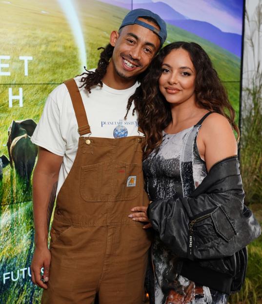 Jordan Stephens and Jade Thirlwall posing together at an event.
