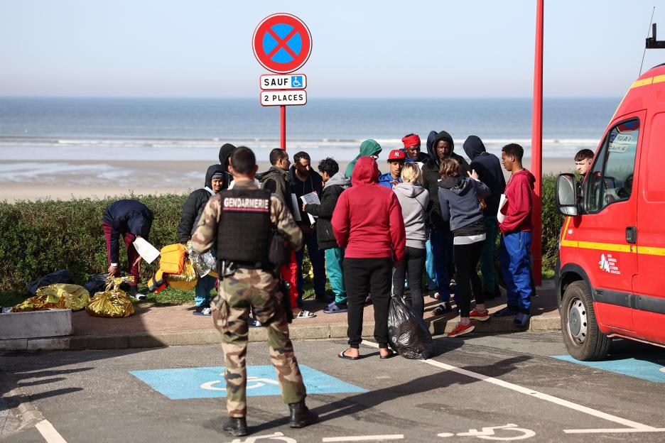 Migrants and rescue personnel gathered at Equihen-Plage after an attempted illegal crossing of the English Channel.