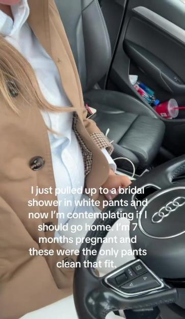 A woman in a car expressing regret about wearing white pants to a bridal shower because she is seven months pregnant.