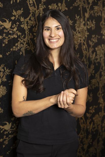 Sofia, 28, a manager from Argentina, smiling.