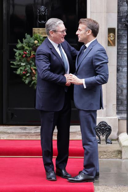 French President Emmanuel Macron and Prime Minister Keir Starmer shaking hands outside No 10 Downing Street.