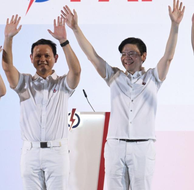 (250504) -- SINGAPORE, May 4, 2025 (Xinhua) -- Singapore's Prime Minister Lawrence Wong (2nd R) waves to supporters of the People's Action Party (PAP) after the party has secured a simple majority in the general election, at Singapore's Yio Chu Kang