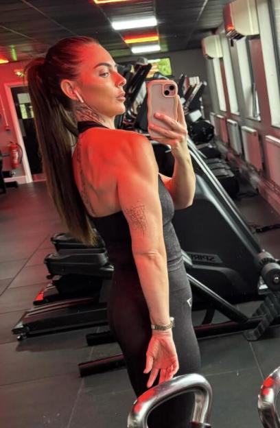 Amy Salmon taking a selfie in a gym.