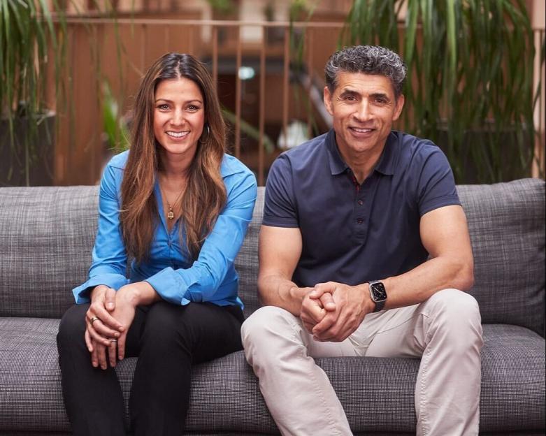 Dr. Sonia Szamocki and Professor Ama Johal sitting on a couch.