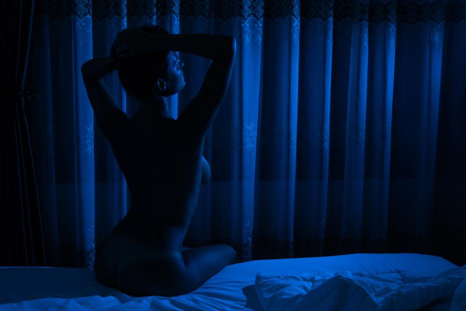Silhouette of naked woman in the moonlight