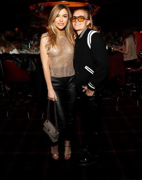 Chrishell Stause and G Flip pose together at Drake's Hollywood grand opening.