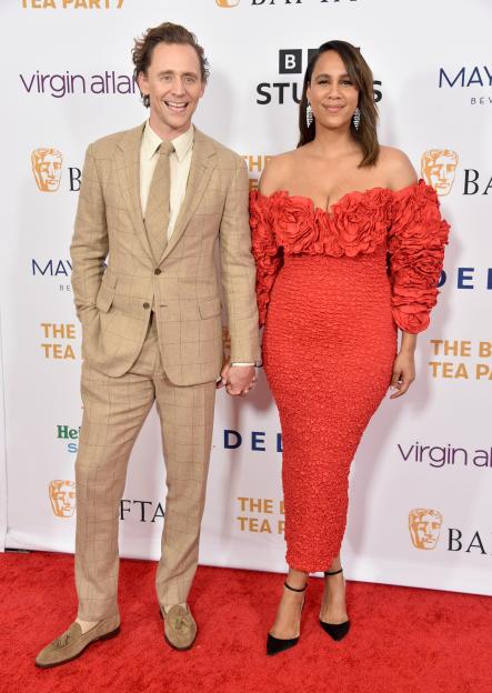 Tom Hiddleston and Zawe Ashton holding hands at the BAFTA Tea Party.