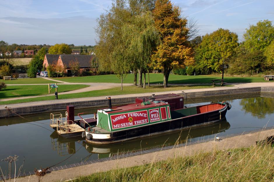 Two boats moored on the Ashby Canal at Moira Furnace, Leicestershire, England.