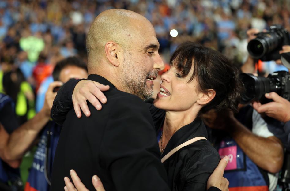 Manchester City manager Pep Guardiola kissing his wife Cristina Serra after winning the UEFA Champions League.