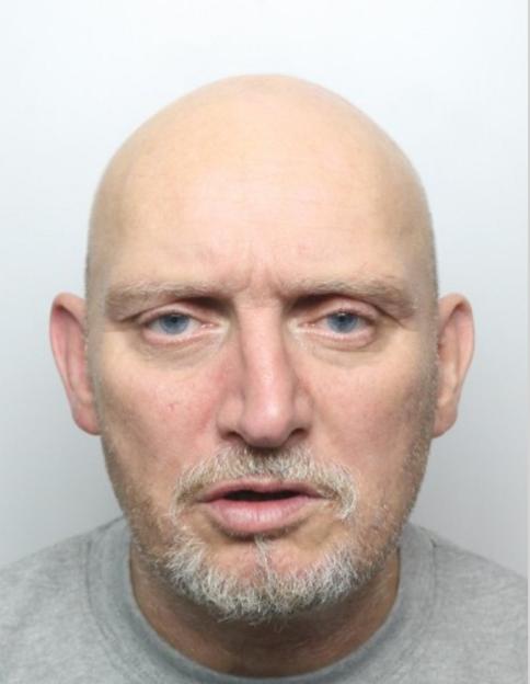 Mugshot of Stephen Bradley, a bald man with a gray beard and blue eyes.