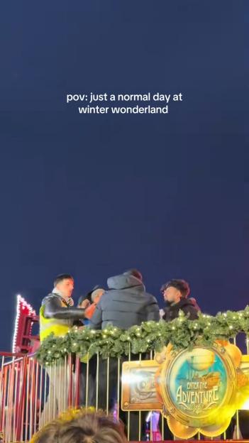 Group of people in Winter Wonderland with an "Enter the Adventure" sign.