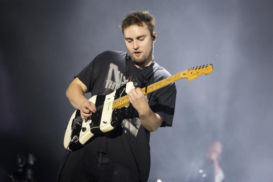Sam Fender playing guitar onstage at Syd For Solen Festival.