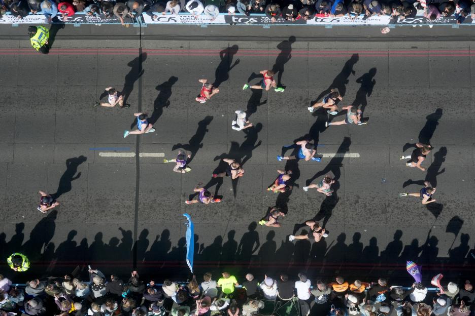 Aerial view of runners crossing Tower Bridge during the 2026 TCS London Marathon.