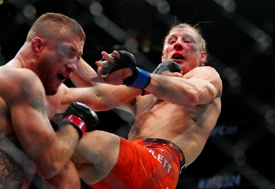 Justin Gaethje (left) lands a kick to Paddy Pimblett's chest during a UFC match.