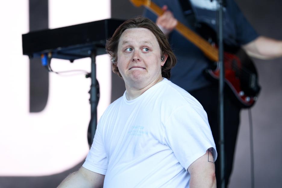 Lewis Capaldi performing on stage.