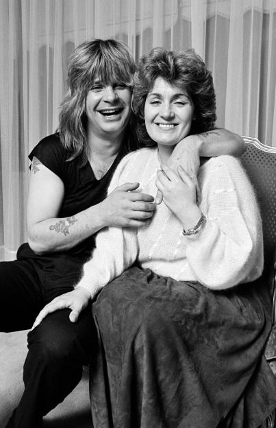Ozzy Osbourne with his arm around Sharon Osbourne.