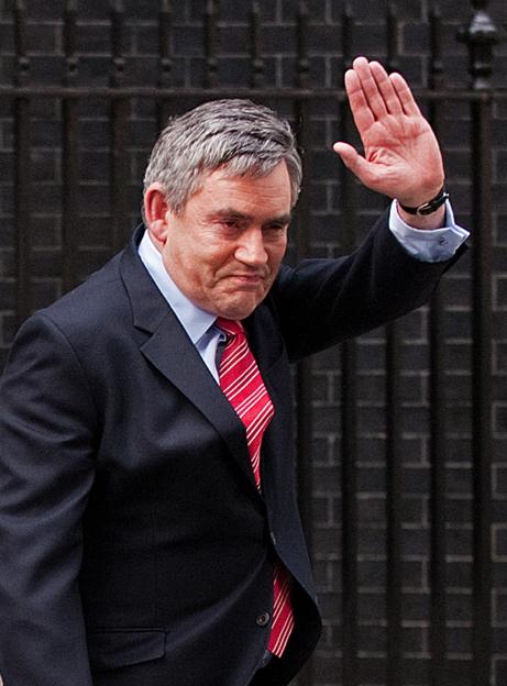 Gordon Brown waves as he announces his resignation as Prime Minister.