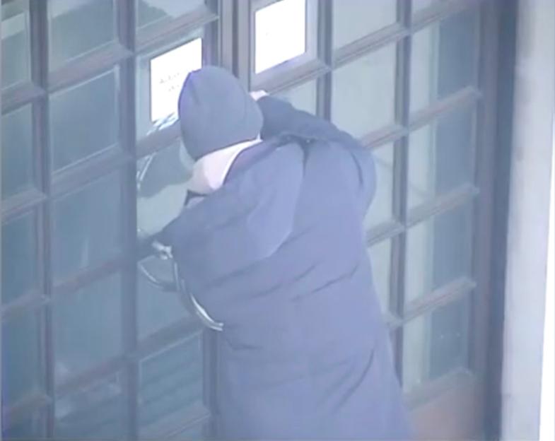 CCTV image of Julian Valente Pereira leaving a fake stick of dynamite outside the headquarters of MI5.