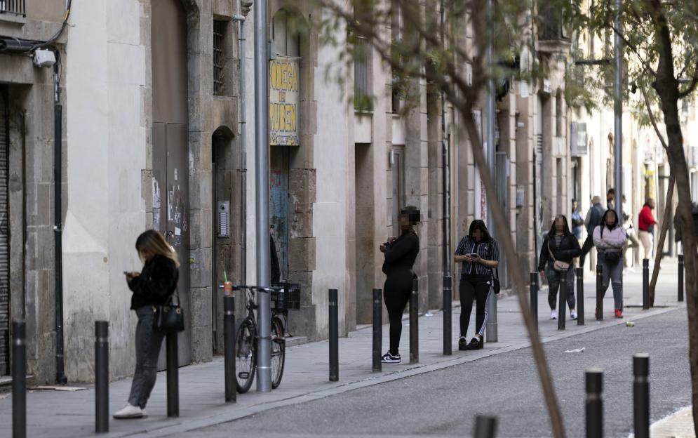 Women standing on a street in Barcelona.