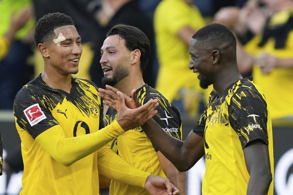 Serhou Guirassy and Jobe Bellingham celebrate a goal at Signal Iduna Park.
