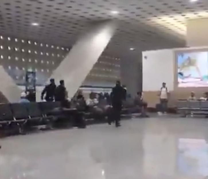 VIDEO: Passengers 'attack' airport staff in shocking brawl after being thrown off plane for alleged drunken rampage