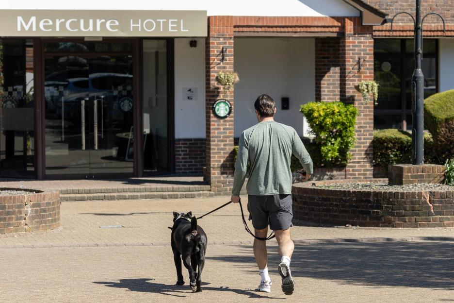 Jack Fincham with his dog Elvis outside the Mercure Hotel.