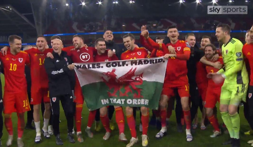 Gareth Bale and the Wales football team celebrate qualification for Euro 2020 with a banner reading "Wales. Golf. Madrid. In That Order."