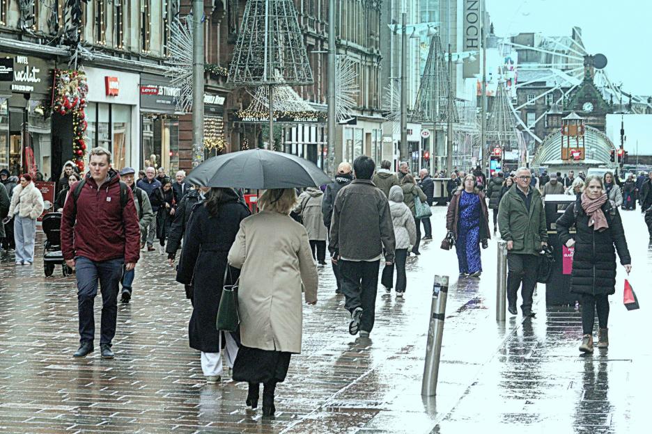 Glasgow, Scotland, UK. 9th December, 2025. UK Weather: Storn Bram covered the city in dark cloud, wind and rain as locala and tourists were on the streets of the city centre. Christmas shopping on the style mile and shopping capital of sctland, b